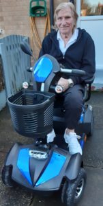 Roy Hurson-Hughes on a mobility scooter